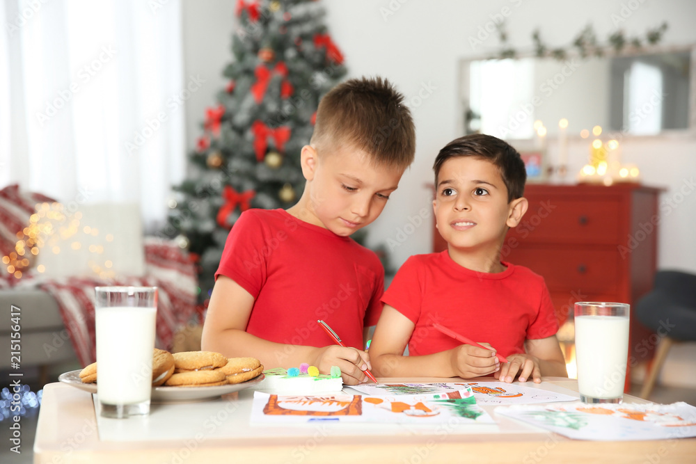 Little children drawing picture at home. Christmas celebration