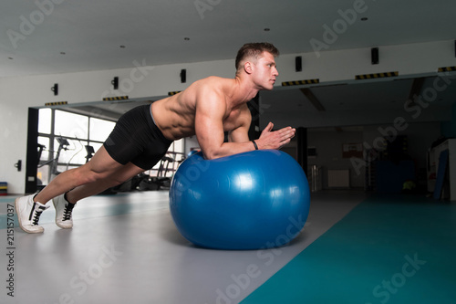 Fitness Man Doing Abdominal Exercise On Ball