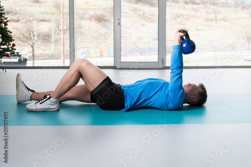 Muscular Man Exercising With Kettle-bell