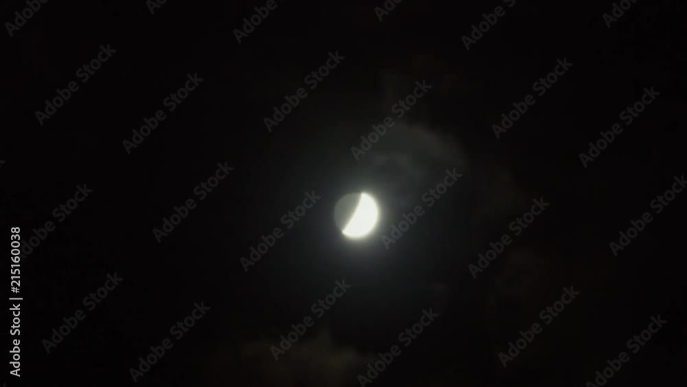 Timelapse of quarter moon behind clouds Timelapse of quarter moon behind clouds