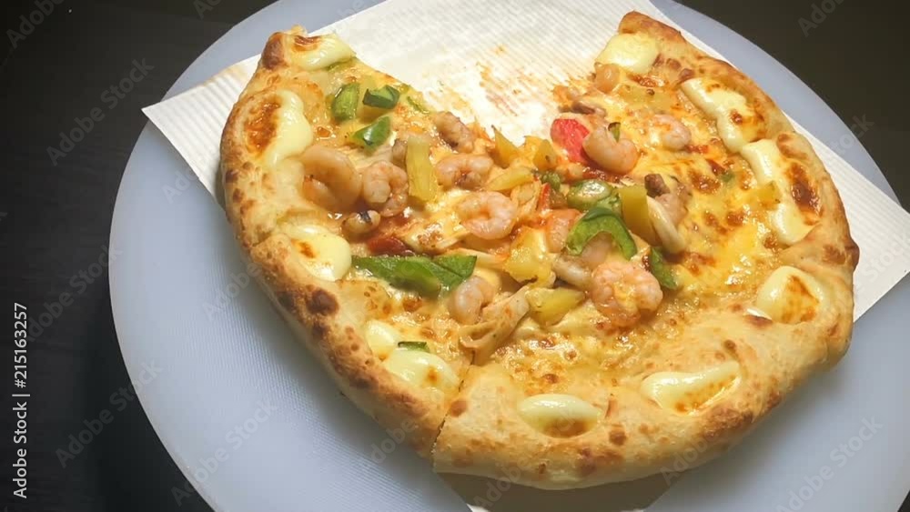 Rotated of seafood pizza slow motion Rotated of seafood pizza slow motion