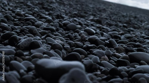 black pebbles and reynisdrangar in Iceland photo