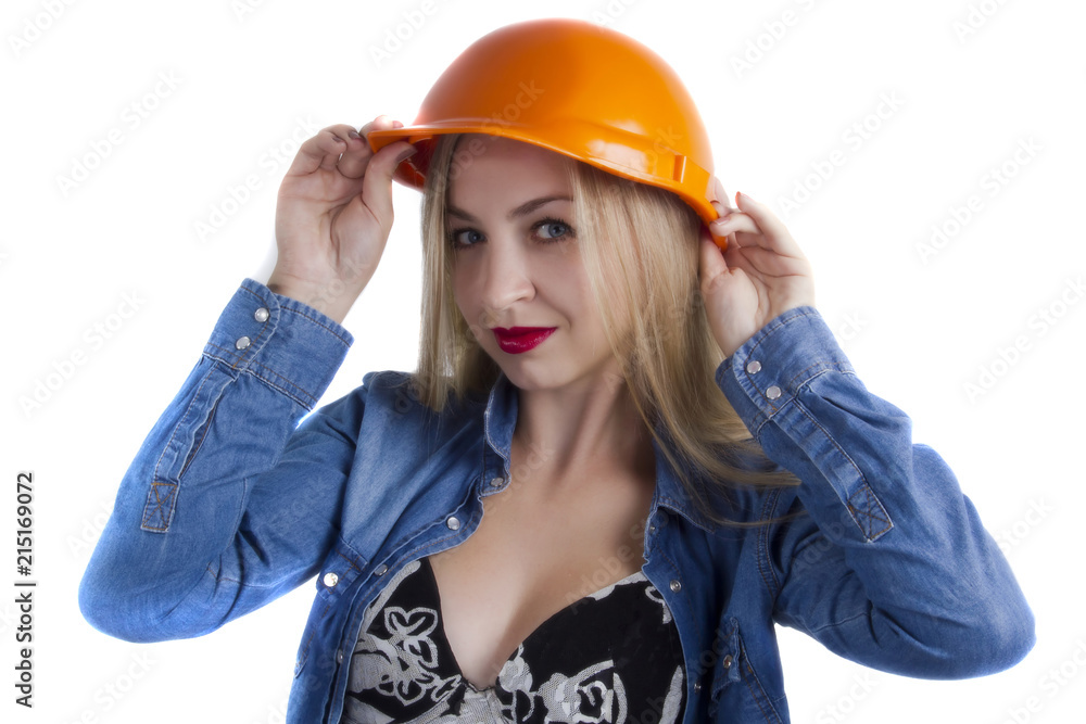 Young woman in a construction helmet Young woman in a construction helmet