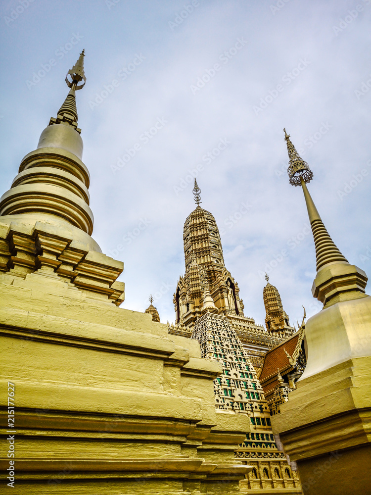 Fototapeta premium Golden buddhist temple with stupa, replica of an ancient thai temple in Ancient City at Muang Boran in Thailand, Buddhavas of the Substanceless Universe