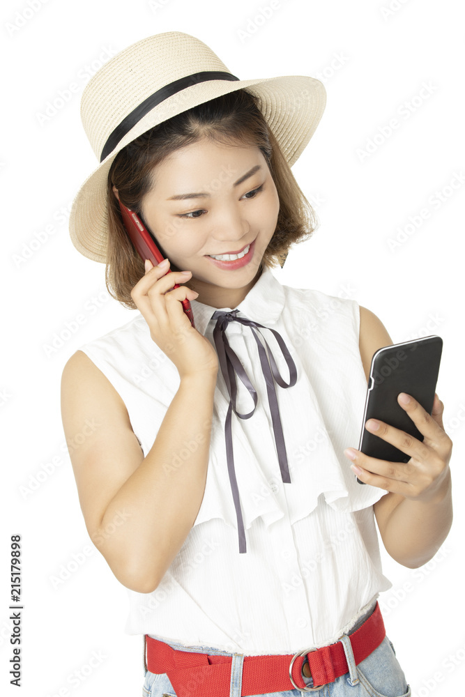 Chinese woman talking on two smart phones at the same time isolated on a white background Chinese woman talking on two smart phones at the same time isolated on a white background