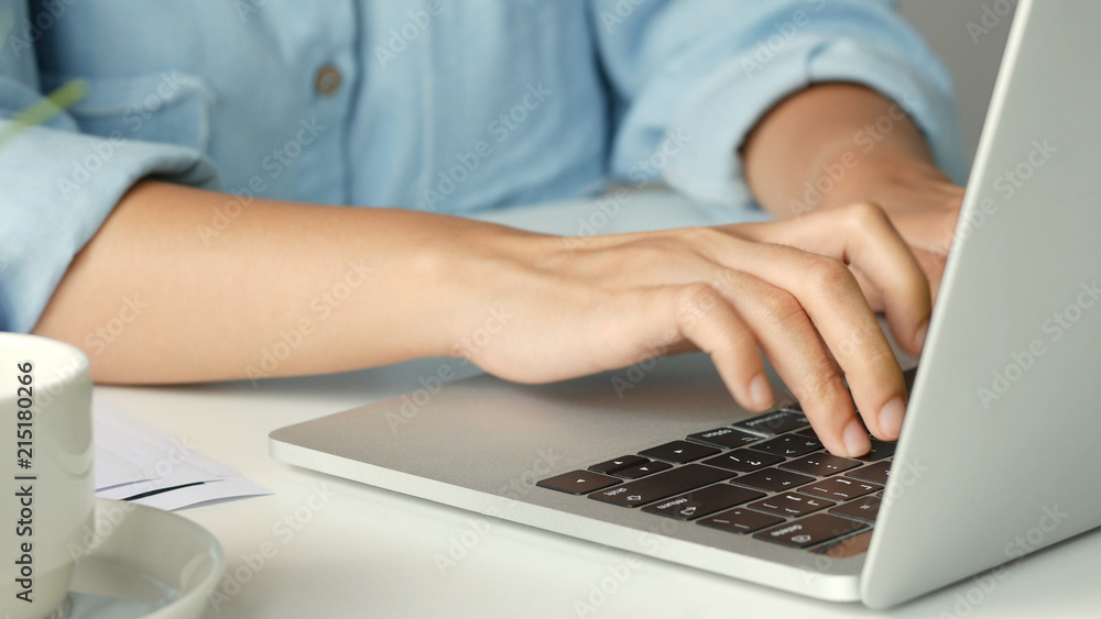 Close-up female hands touch on keyboard laptop, Working on her computer at office, Working from home. Close-up female hands touch on keyboard laptop, Working on her computer at office, Working from home.
