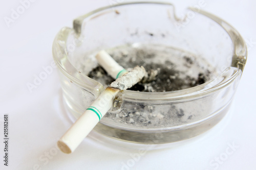 burned cigarettes in tray , no smoking concept
