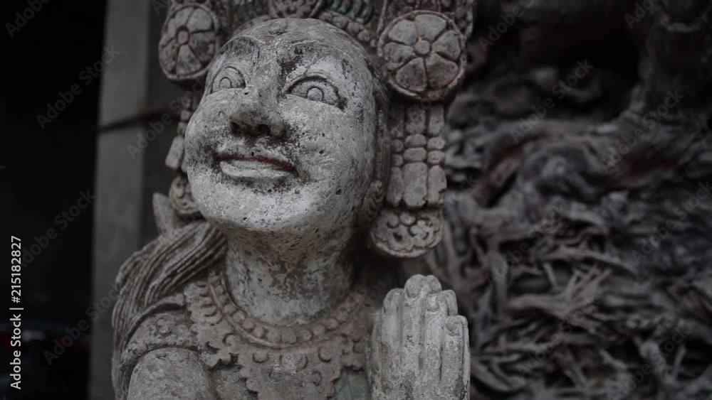 3 in 1 Smooth panoramic in slow motion of an hinduist statue from a god called ganesha. Every day balinese people bring offerings to it.