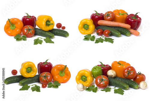 Fototapeta Naklejka Na Ścianę i Meble -  Red yellow and orange peppers with tomatoes on a white background..Cucumbers with colorful peppers in composition on a white background.