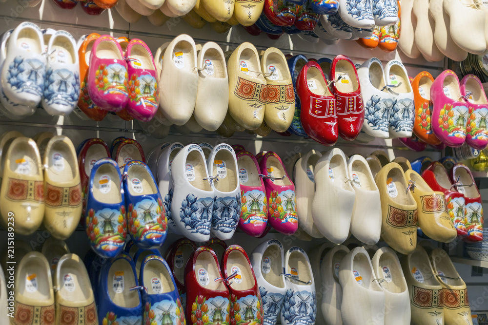 Amsterdam, Netherlands - July 02, 2018: Klomp - Dutch wooden shoes in the shop window Amsterdam, Netherlands - July 02, 2018: Klomp - Dutch wooden shoes in the shop window