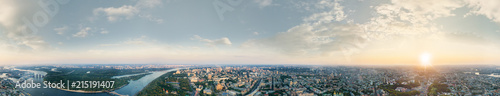 A big 360 degrees panorama of the city of Kiev at sunset. A modern metropolis in the center of Europe against the backdrop of sunset sky from a bird's eye view. Aerial view. Panorama of the Tourist © LALSSTOCK