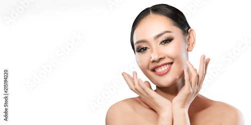 Beauty shot of young pretty asian woman with clear skin ongrey background, for skin ad and cosmetology