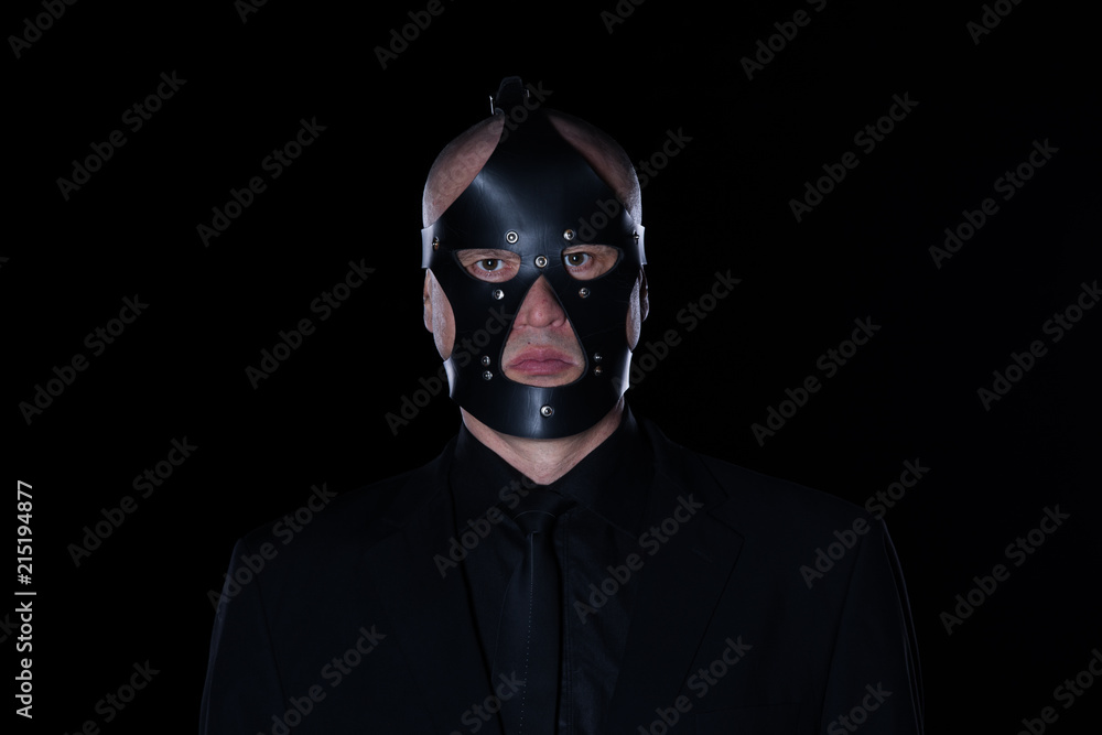 a man in a black mask on a black background a man in a black mask on a black background