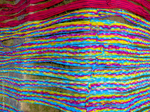 Colorful fabric hanging to dry after traditional process Brid eye view, in Mojolaban  © Ara Creative