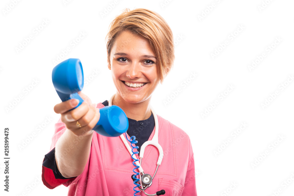 Portrait of female vet wearing pink scrub handing blue receiver. Portrait of female vet wearing pink scrub handing blue receiver.