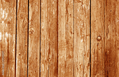 Old grunge wooden fence pattern in orange tone.
