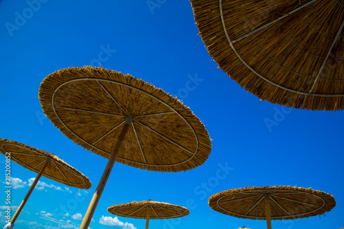 Wooden beach umbrella under the blue sky   Looking at view. Copy space