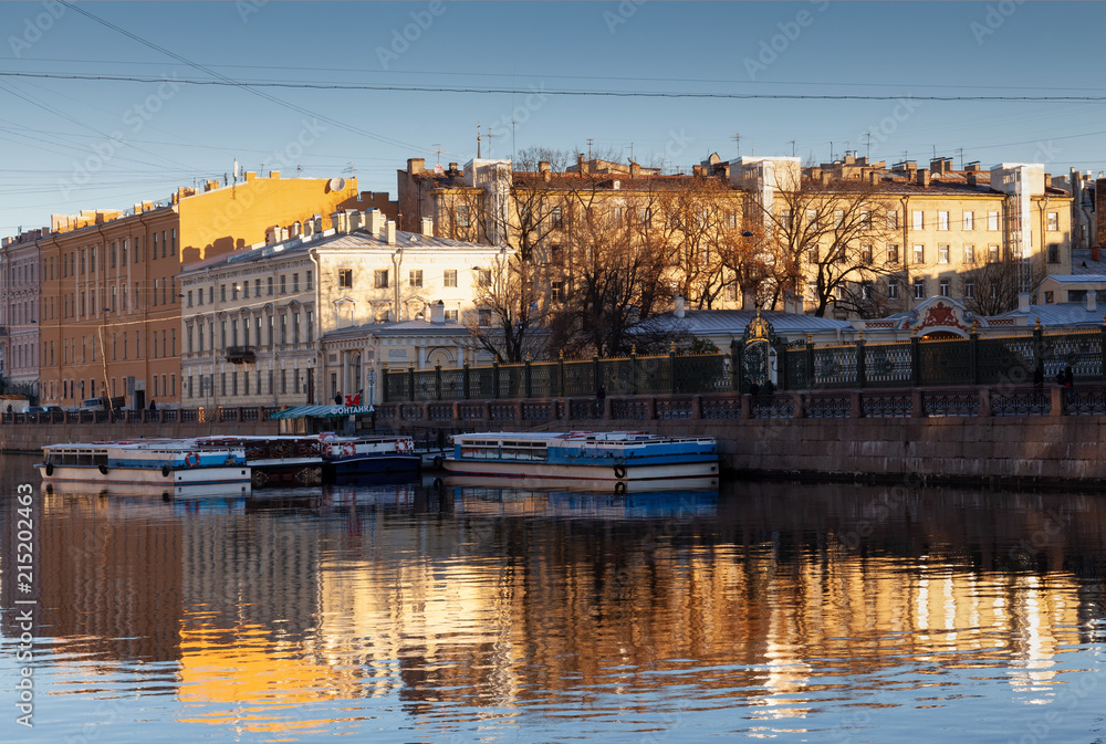 Boats on the Fontanka river in the frosty autumn morning. Saint-Petersburg.
