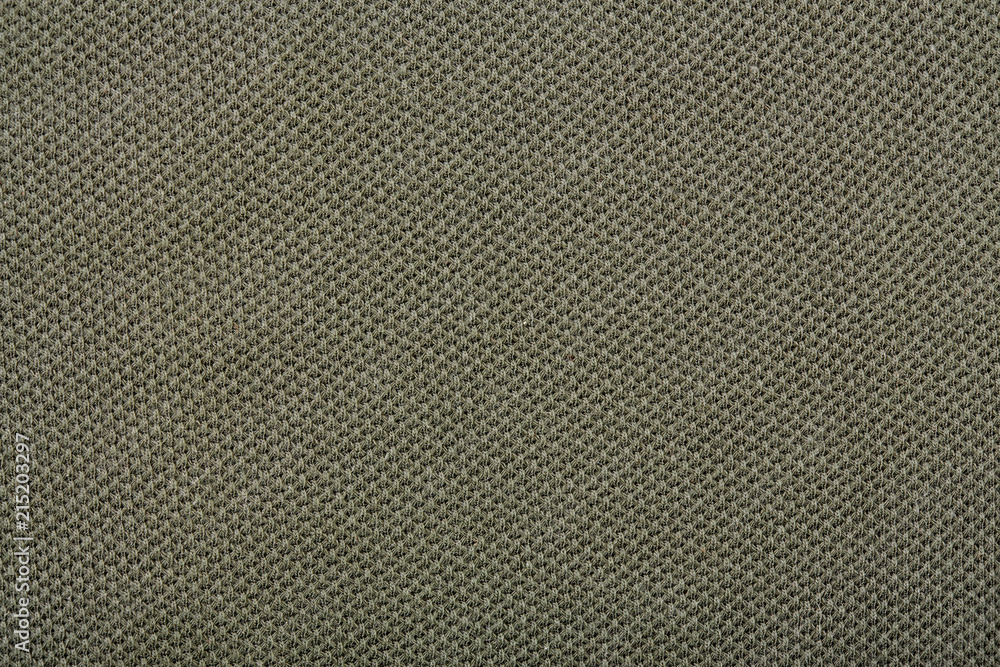 Cotton textured fabric of sports pants, green. texture of natural fabric. Cotton textured fabric of sports pants, green. texture of natural fabric.