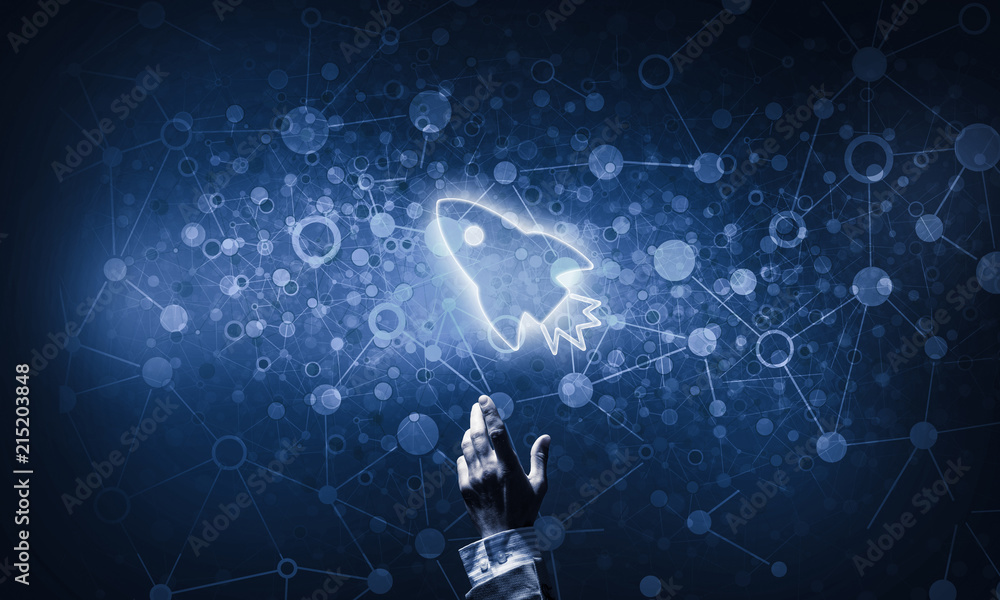 Fototapeta premium Technology idea concept with glowing rocket icon and touching it