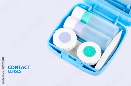 Contact lens, contact lens case, tweezers on white background. Correction of vision.
