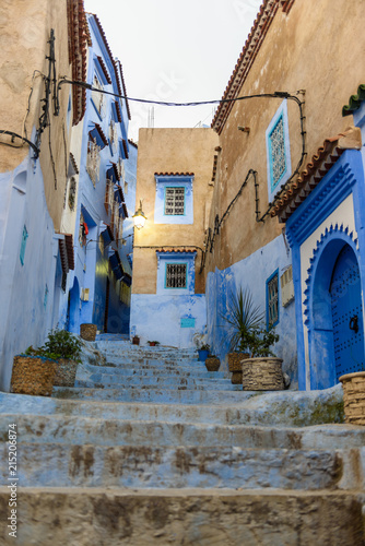 Street of Chefchaouen with blue door © luisapuccini