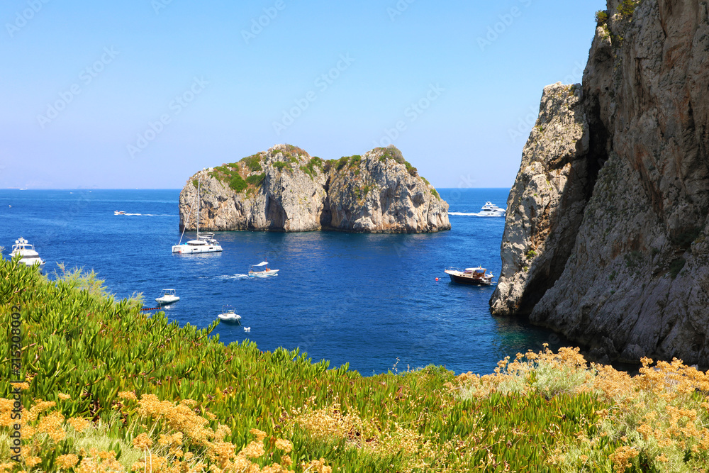 The Faraglioni Rocks on the coast of the Capri Island, Italy