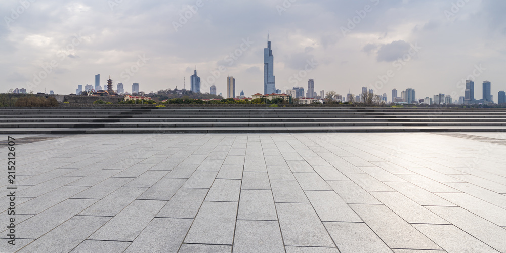 Panoramic skyline and modern business office buildings with empty road,empty concrete square floor