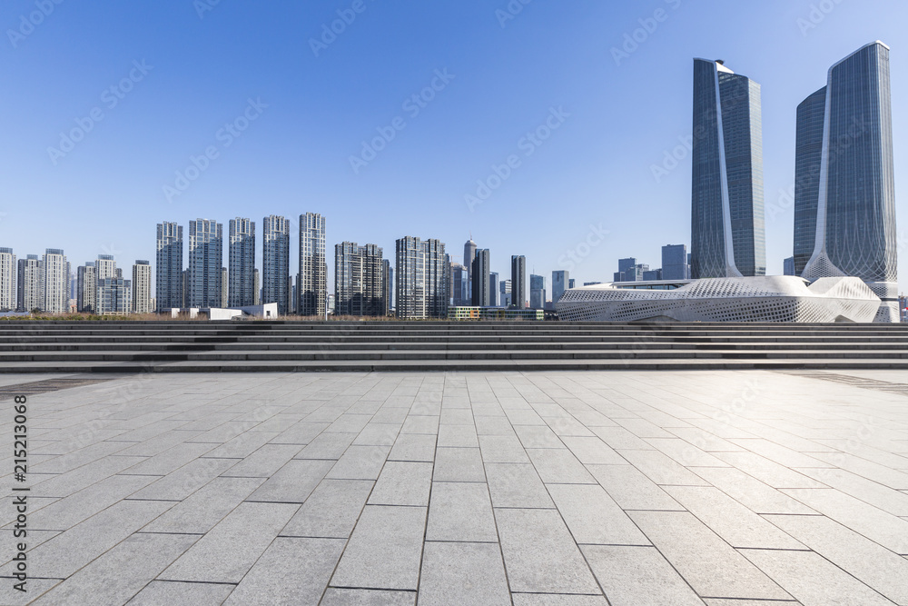 Panoramic skyline and modern business office buildings with empty road,empty concrete square floor