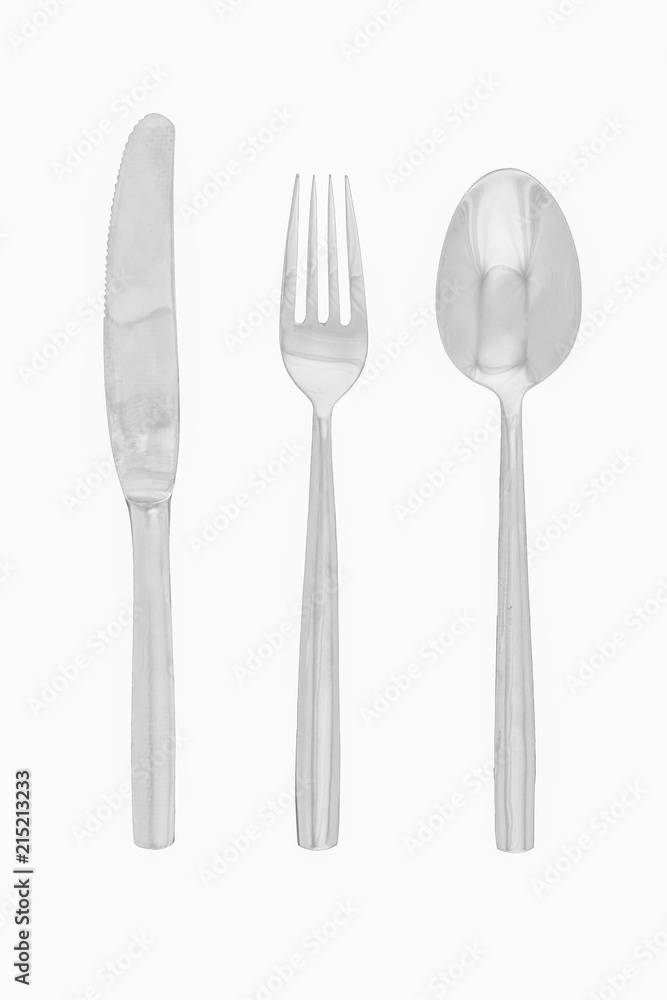Set of cutlery, spoon fork and knife made of silver isolated on white background with clipping path Set of cutlery, spoon fork and knife made of silver isolated on white background with clipping path