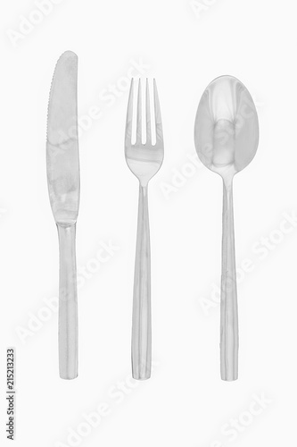 Set of cutlery, spoon fork and knife made of silver isolated on white background with clipping path