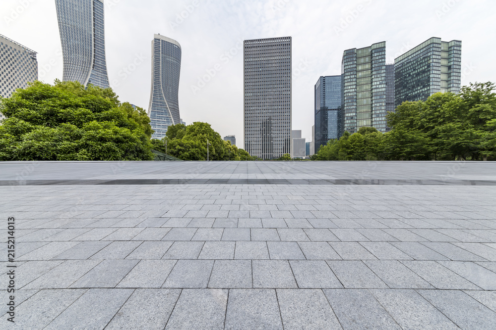 Panoramic skyline and modern business office buildings with empty road,empty concrete square floor Panoramic skyline and modern business office buildings with empty road,empty concrete square floor