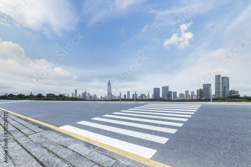 Panoramic skyline and modern business office buildings with empty road,empty concrete square floor © MyCreative