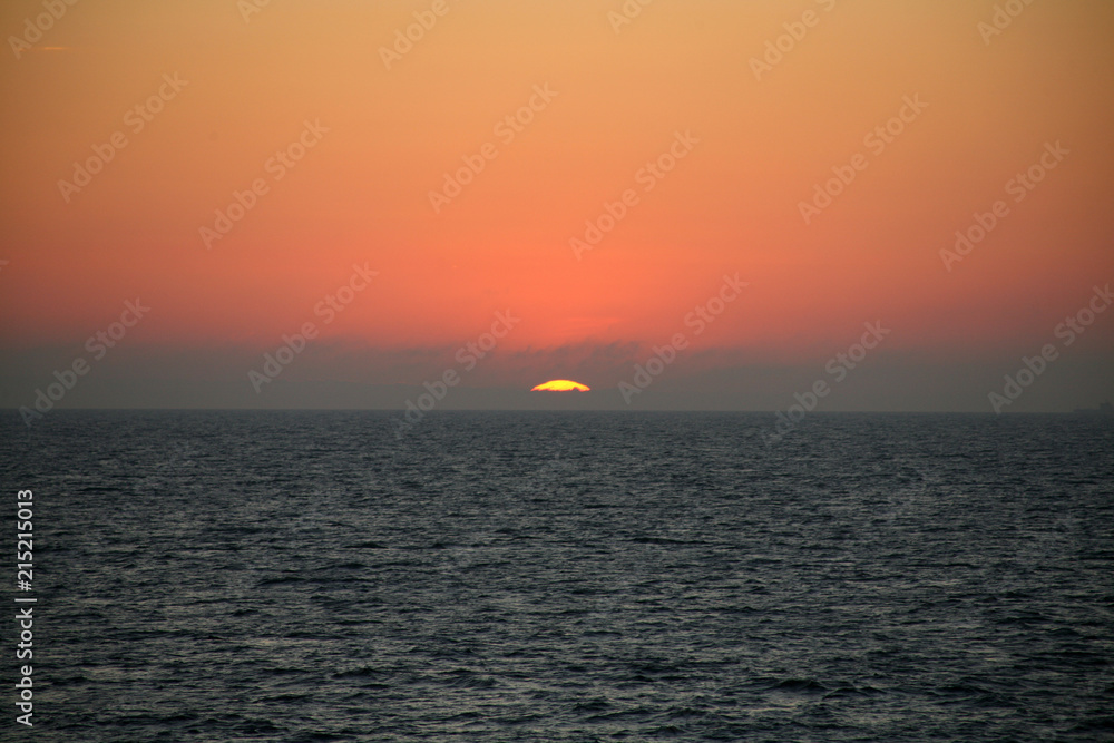 The sun falls into the Ocean. 002. 