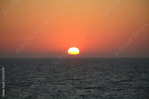 Fototapeta Naklejka Na Ścianę i Meble -  The sun falls into the Ocean. 001.