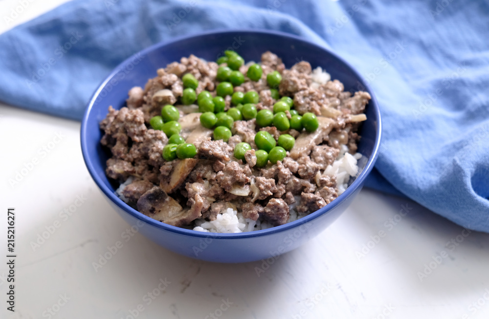 Bowl with delicious beef stroganoff dish near cloth Bowl with delicious beef stroganoff dish near cloth