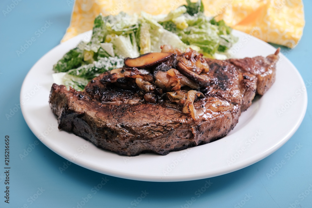 Roasted beef and caesar salad on plate Roasted beef and caesar salad on plate