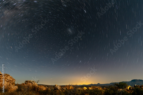 Canvas Print Star trails in the night sky just after sunset at Kagga Kamma Nature Reserve in