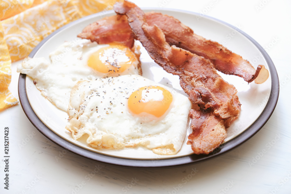 Delicious breakfast with fried bacon and eggs Delicious breakfast with fried bacon and eggs