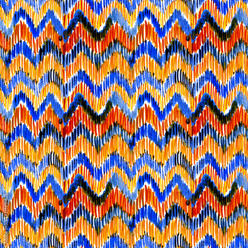 Watercolor orange and blue ikat vibrant seamless pattern. Trendy tribal pattern in watercolour style. Peacock feather for fabric, textile, ceramic