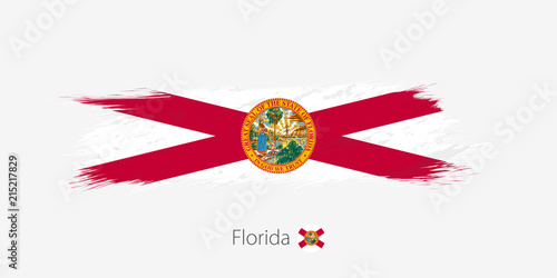 Flag of Florida US State, grunge abstract brush stroke on gray background.