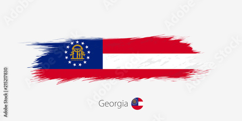 Flag of Georgia US State, grunge abstract brush stroke on gray background.