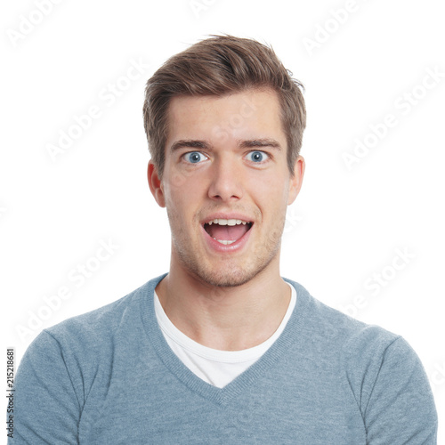 young man looking pleasantly surprised with open mouth
