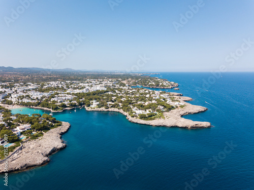 Aerial: Cala D'Or resort town in Mallorca, Spain © castenoid