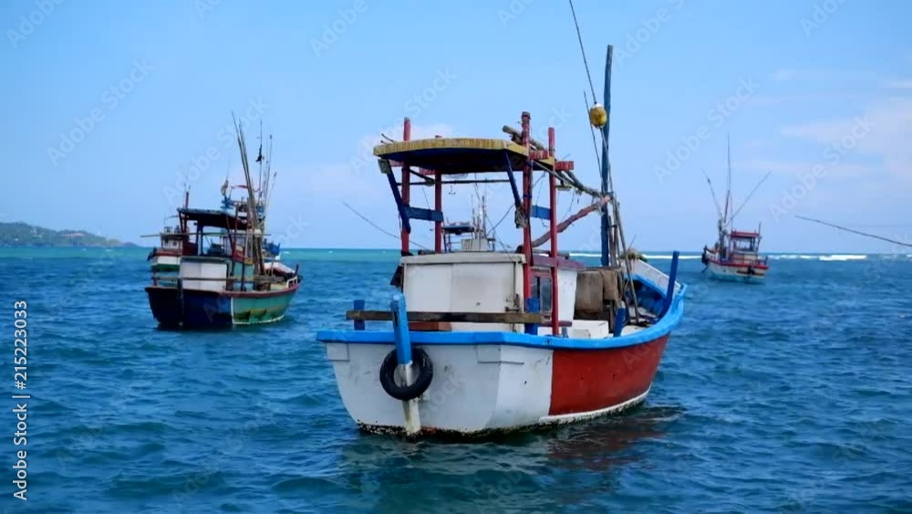 Colorful boats of fisherman on blue water in sri lanka. Colorful boats of fisherman on blue water in sri lanka.