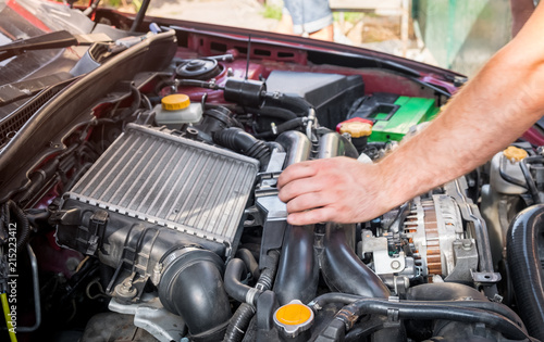 repair and maintenance of the car, men's hands hold technical car engine service
