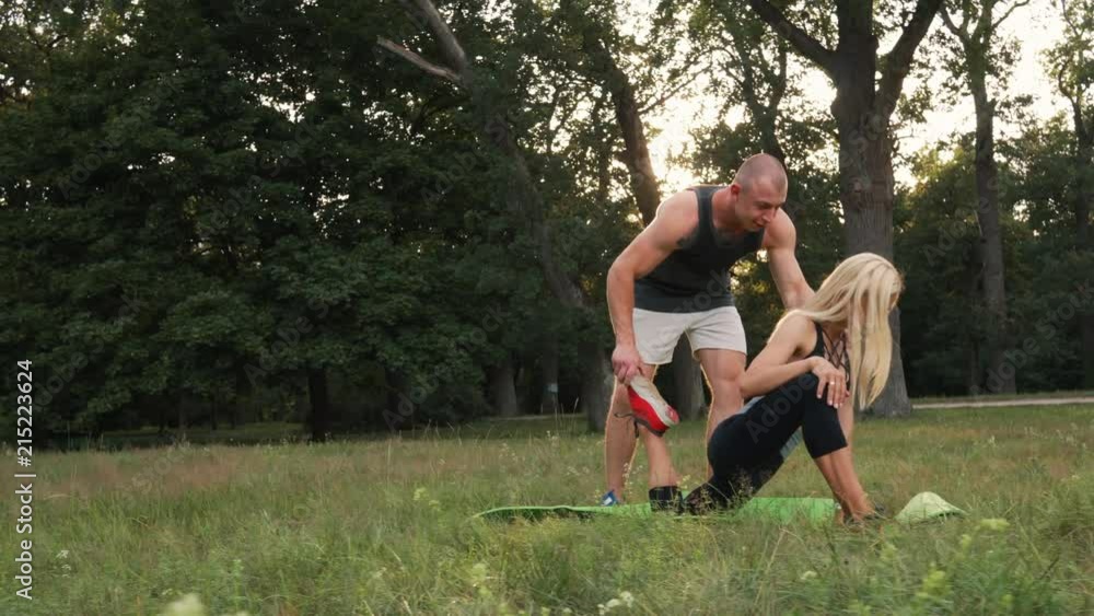 young spouses doing gymnastics in nature young spouses doing gymnastics in nature