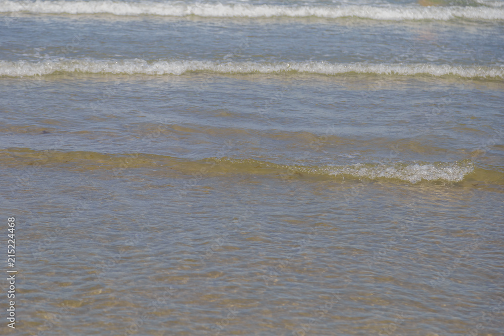 Lake Water Surface with Small Waves on Warm Sunny Bright Summer Day with No People. Lake Shore Water Background near Coastal Line with Sun Reflections, Nature Scenic Seascape