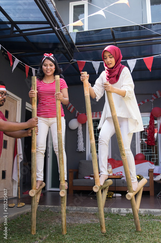 indonesian stilts race competition photo