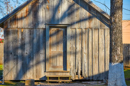 Wooden house cabin in the park gray brown